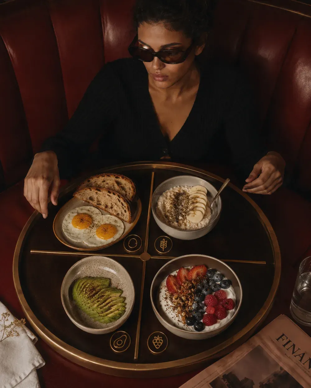 Four-part breakfast table showing eggs, avocado, oats, and yogurt as a balanced high-protein breakfast formula