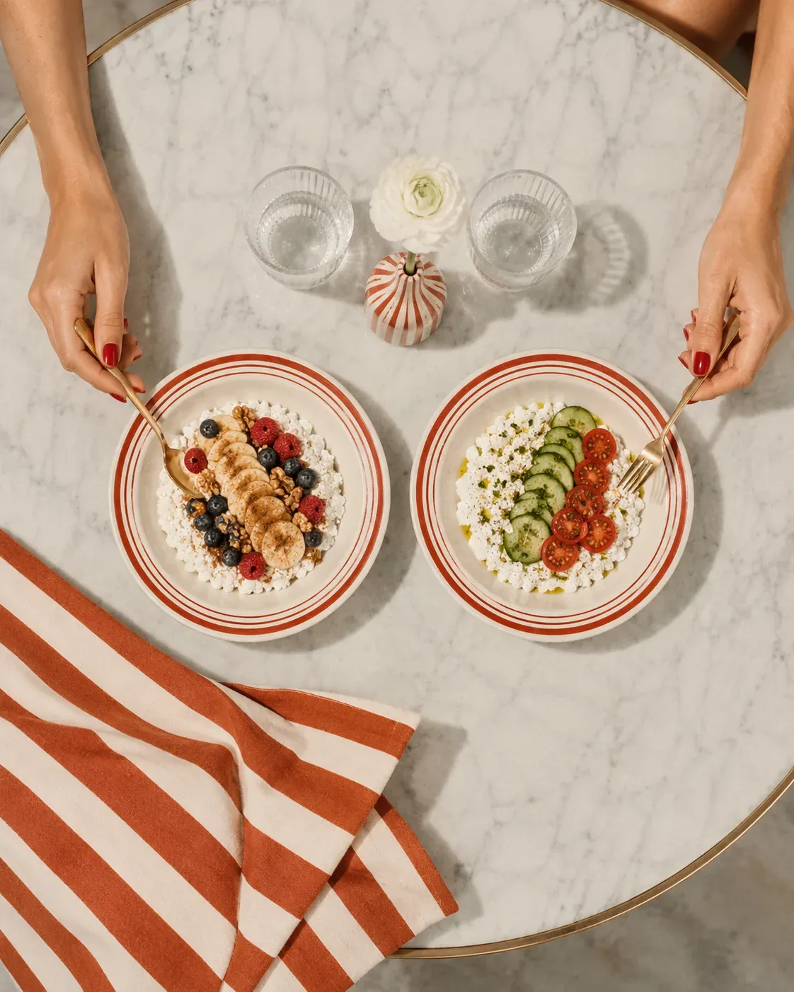 Two cottage cheese snack plates, one sweet with berries and one savory with vegetables, arranged on marble with warm Mediterranean styling | Becoming Elysian quiet luxury wellness