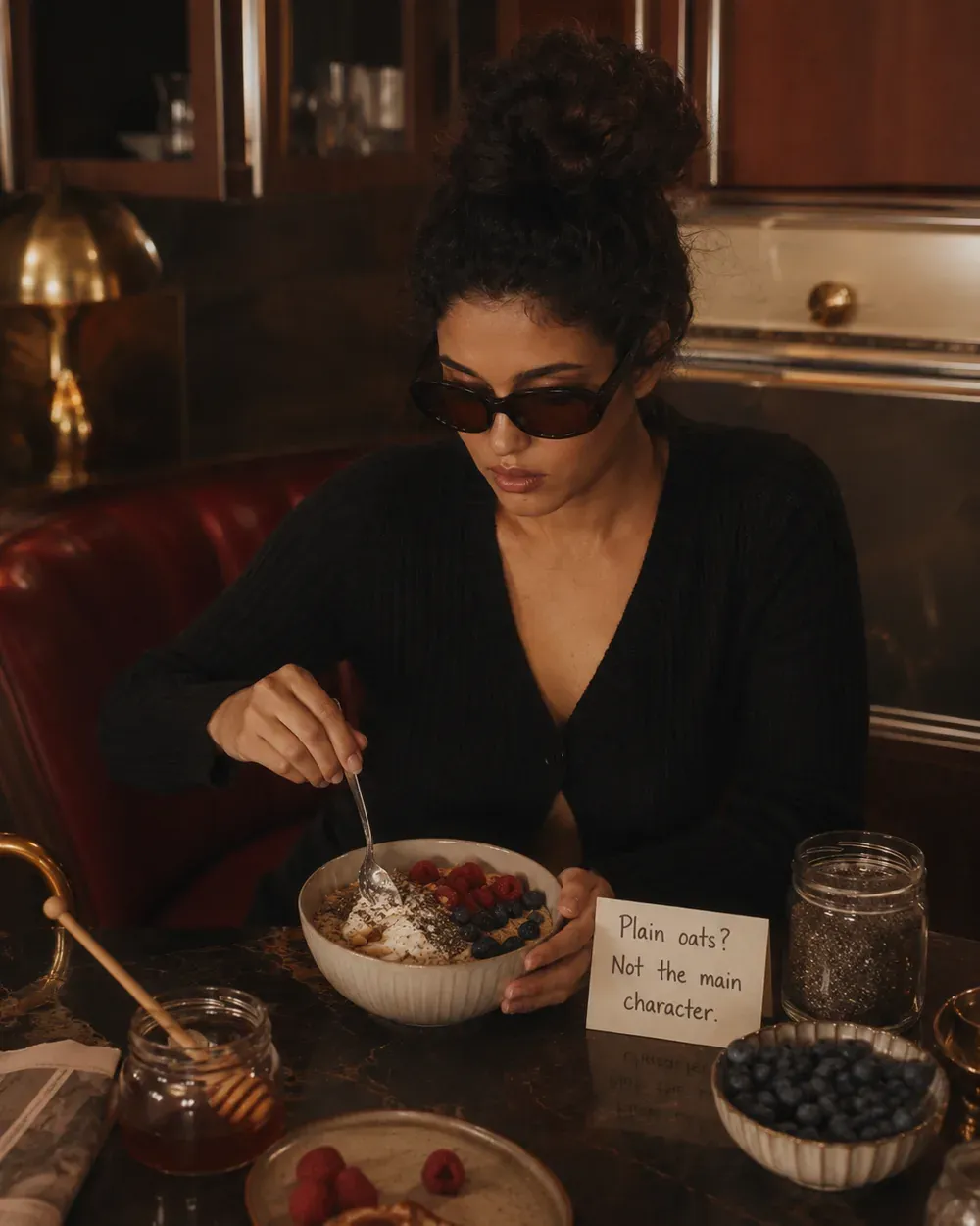 Protein oats with berries, chia seeds, honey, and blueberry bowl beside a note reading plain oats not the main character